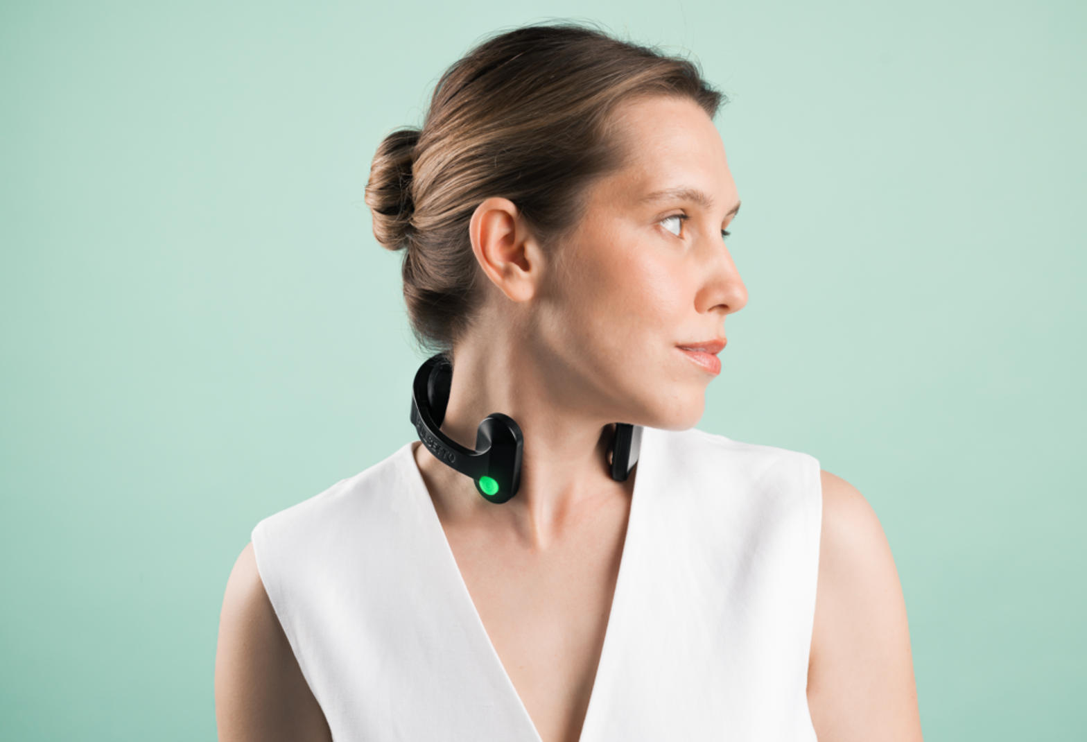 Woman wearing Pulsetto Fit vagus nerve stimulator